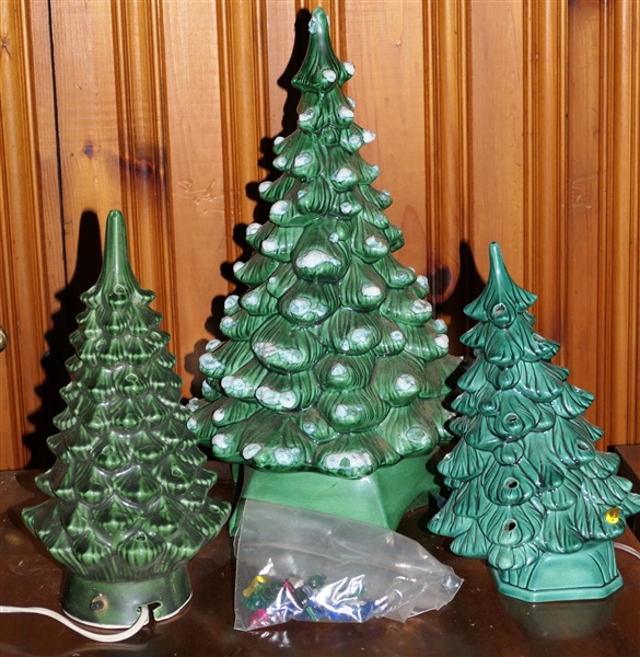 3 Ceramic Christmas Trees - Largest Measures 19" with Attached Stand, Other 2 Are Lighted with Removable Bases - Measuring 13" and 12" - Some Additional Bulbs in Bag