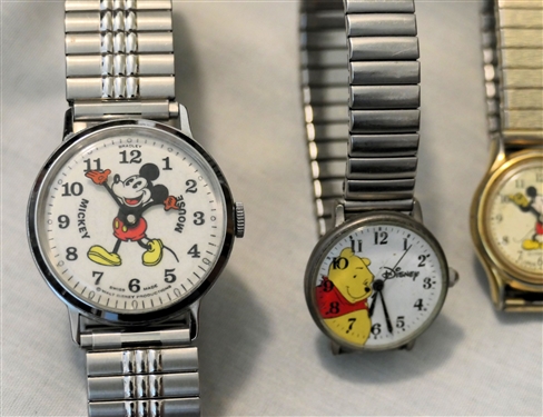 4 Disney Watches - Lorus Mickey Mouse, Winnie The Pooh, Swiss Made Mickey Mouse, and Lorus Mickey Mouse