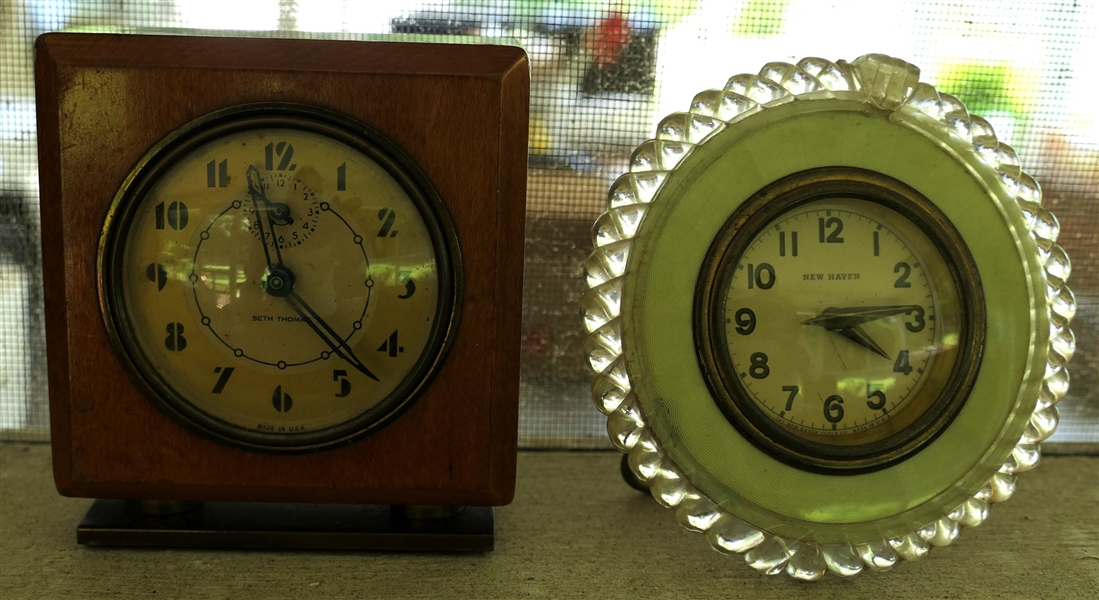 2 Dresser Clocks - Seth Thomas Alarm Clock in Wood Case with Second Register and New Have Clock with Lucite Trim - Seth Thomas Clock Measures 4" tall 3 1/2" by 1 1/4" - Both Clocks Run