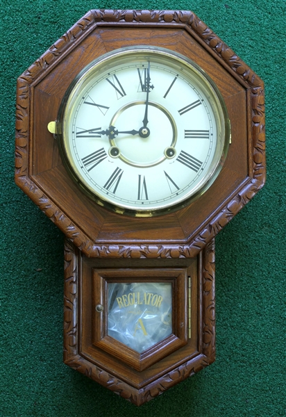 Oak Regulator "A" Wall Clock with Key and Pendulum - Clock Measures 20" Long by 12 1/2" Across