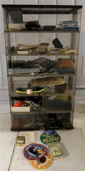 Plastic 6 Tier Display Cabinet with Contents - Lighters, Patches, Sun Glasses, Knives, Costume Jewelry, Etc. - Display Box Measures 24" tall 13" by 9 1/2" - Top Has Crack - See Photo
