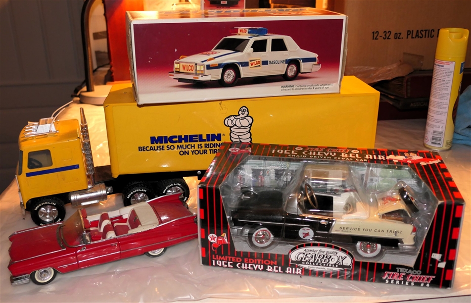 4 Die Cast Vehicles - Nylint "Michelin" Transfer Truck, Wilco Patrol Car, 1959 Cadillac, and Texaco Fire Chief - 1955 Chevy Bel Air