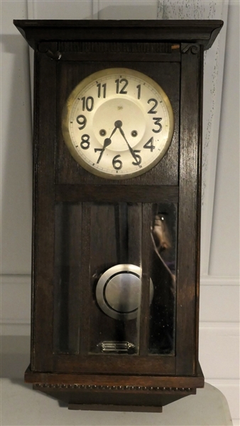 Junghan Oak Hanging Wall Clock with Pendulum - Measures 28" Long - Small Area of Trim Missing Near Top Right 