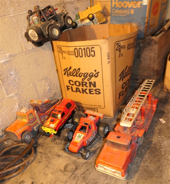 Large Lot of Toys including Buddy L Fire Truck, Metal Wrecker Truck, Battery Operated Remote Control Trucks, Jeep, and Others