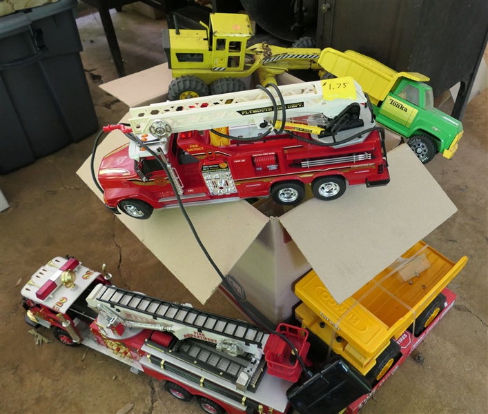 Lot of Toys including New Tonka Dump Truck, Green and Yellow Tonka Dump Truck, Remote Fire Trucks, Road Grader, and Nascar Cars