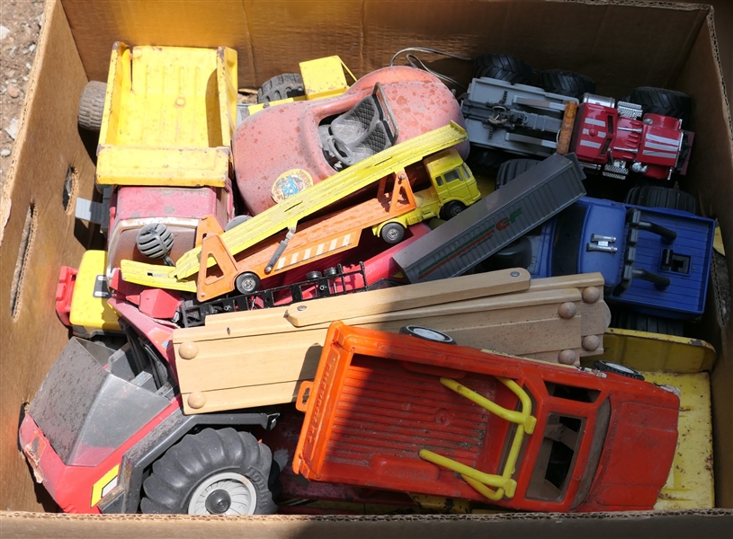 Box of Cars and Trucks including Orange Luv Sport, Tonka Metal Dump Trucks, Wood Toys, and Construction Vehicles