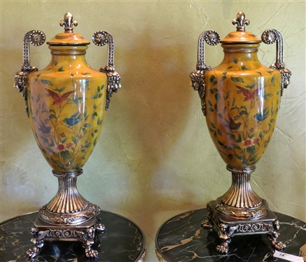 Pair of Decorator Urns - Gold Background with Flying Bird and Flowers - Gold Handles and Base - One Urn Has Some Finish Flaking and Damage to One Handle - Each Measures 19" tall 