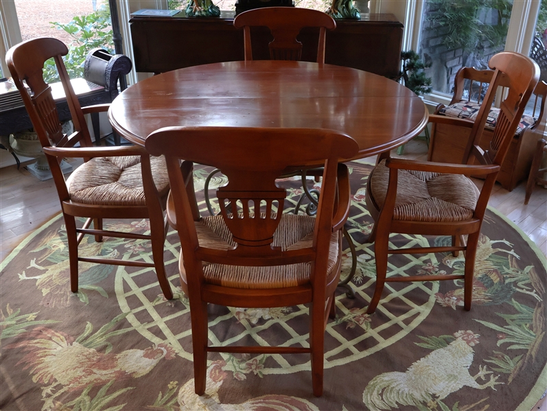 Round Cherry Breakfast Table and 4 Chairs - Table Has Pewter Tone Metal Base - 4 Rush Bottom Captains Chairs with Urn Shaped Chair Backs  - Table Measures 48" Across - Table Has 1 Leaf 