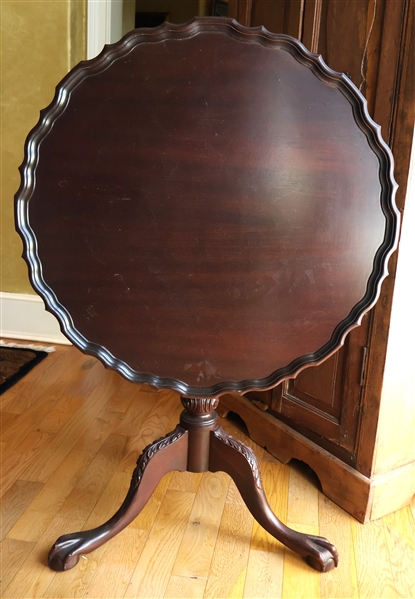Mahogany Tilt Top Tea Table - Carved Pedestal with Ball and Claw Feet - Table Top Has Scalloped Edge - Measures 29 1/2" Tall 32" Across