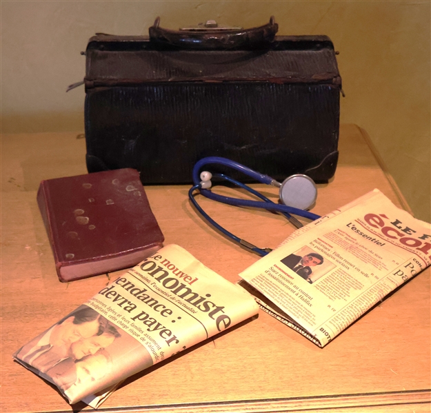 Leather Doctors Bag with Medical Dictionary, Stethoscope, and French Newspapers 