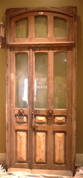 Antique French Door - Imported From France - "Entrée Du Magsin" - Lions Head Knocker and Detail on Sidelight - 3 Pane Window at Top - Door is Pegged and Has Raised Panel Construction - Measures...