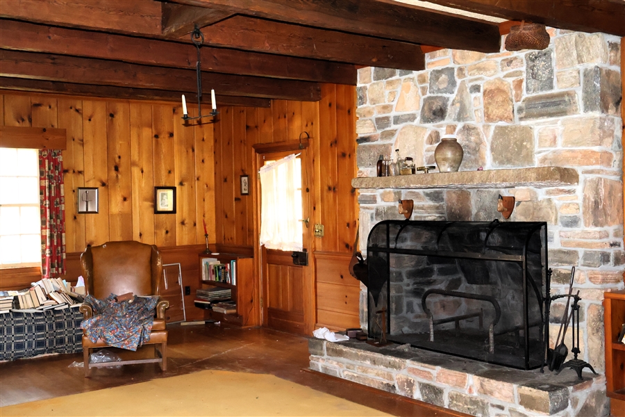 Great Room with Outstanding Rock Fireplace, Tonge and Grove Pine Paneling and Wainscoating Hardwood Floors