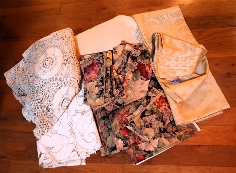Lot of Linens including Round Quilted Williams Sonoma Table Cloth, Round Crochet, Wedgwood England Tablecloth, and Floral Napkins and Placemats