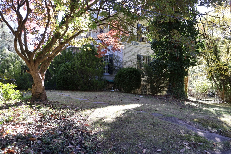 Front Right Corner of The Home - Mature Trees on Lot