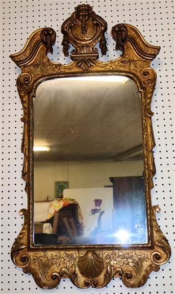 Very Handsome Gold Gilt Mirror - Broken Arch Top with Face and Scrolled Details - Shell At Bottom - Frame Measures 43" by 23" 