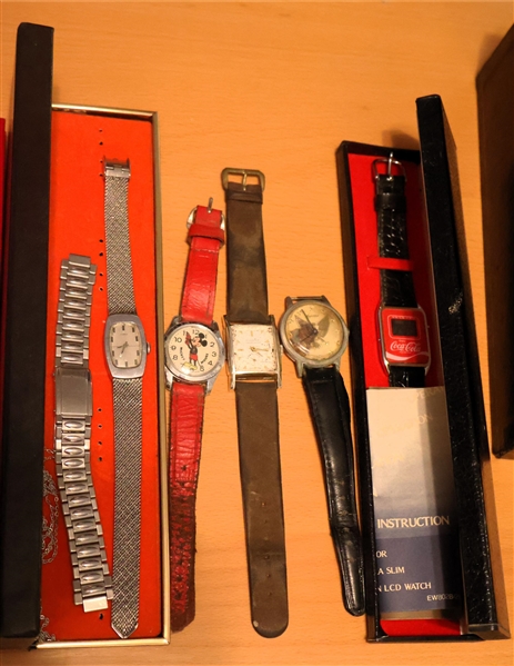 Lot of Wrist Watches including Swiss Made Mickey Mouse, Lucerne with Eagle Dial, Coca Cola Watch, New Brook Antimagnetic, and Timex 