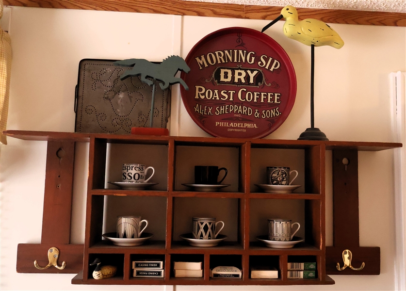 Hanging Wood Wall Display Shelf with Brass Hooks and Contents including Remington Playing Cards, Wood bird and Horse, 222 Fifth Espresso Cup and Saucers, and Punched Tin Tray