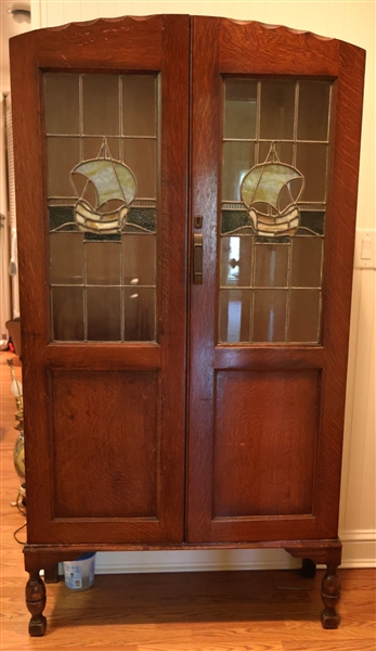 Oak Cabinet with Leaded Glass Doors - Leaded Glass Sailing Ships on Each Door - 4 Oak Shelves Inside - Cabinet Measures 66" Tall 36" by 13" 