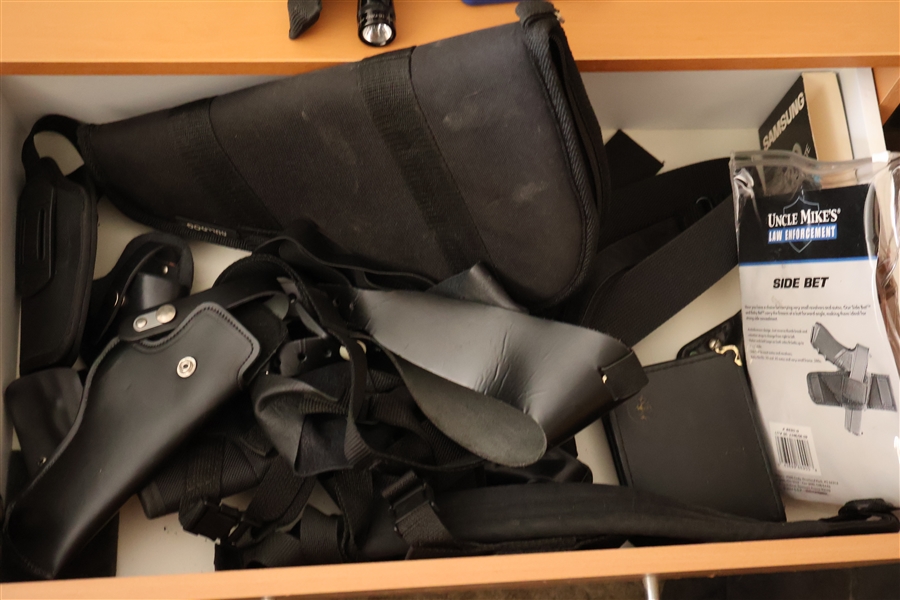 Drawer Full of Pistol Holsters - Leather, Belt Holsters, Ankle Holster, and Others