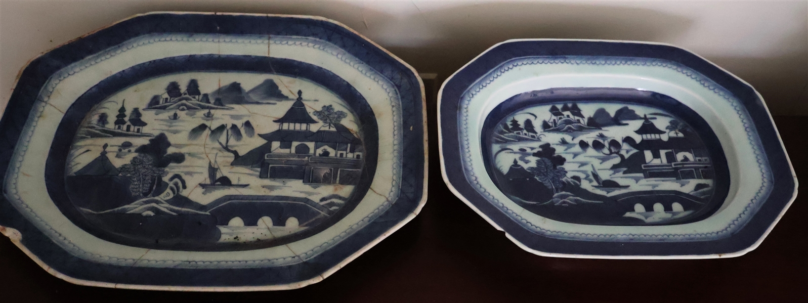 2 Blue and White Chinese Export Canton Platters - Larger Platter Has Early Stapled Repairs - Smaller Has Chip - Large Platter Measures 16 1/2" by 13 1/2" 