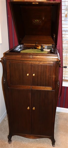 Victor Victrola - Model - VV120 - In Mahogany Case - With Disc Storage - Has Additional Reproducers, Needles, and Dustoff Record Cleaner - Front Leg Has Been Repaired - Measures 48 1/2" Tall 23" by...