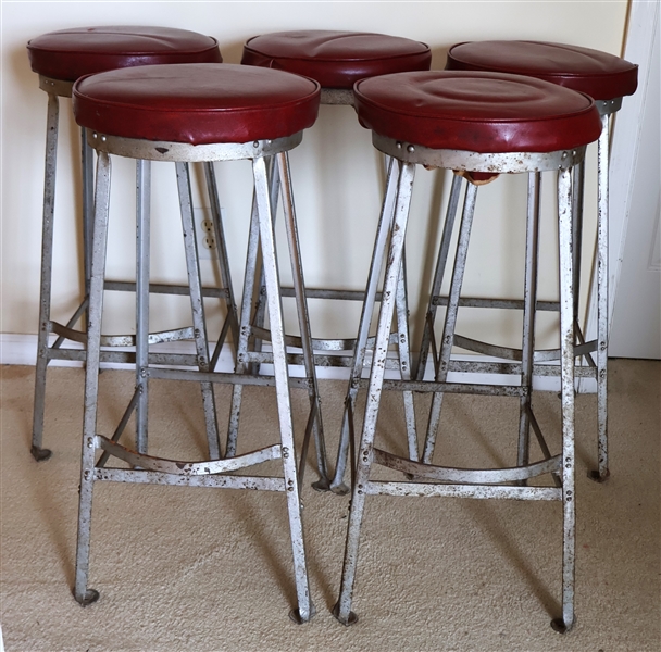 5 - 1940s Metal Bar Stools with Foot Rests - Metal Frame with Bolt Down Feet - Red Vinyl Seats - Each Stool Measures 31" Tall 13 1/2" Across