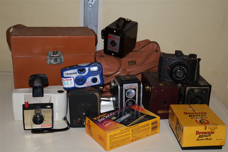 Lot of Cameras including Kodak Brownie, Kodak Disc 3600, Polaroid in Case, Spartus - 120, and Polaroid Swinger Land Camera, Kewpie by Eastman, and Ansco