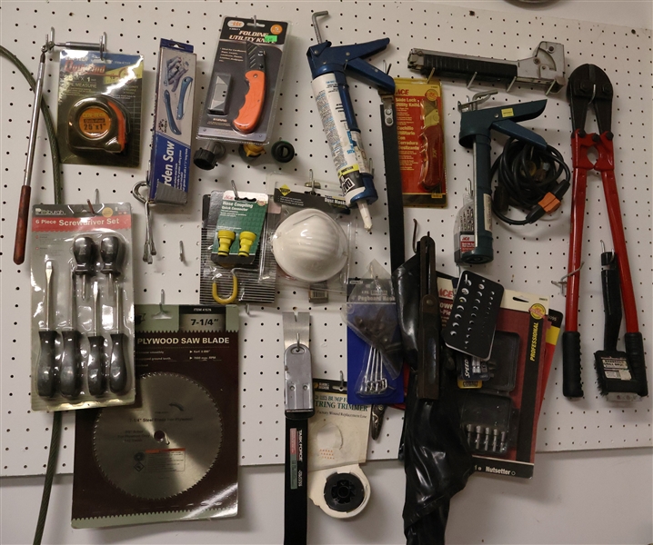 Tool Lot including Bolt Cutters, Staple Gun, Folding Utility Knife, Screwdrivers, Garden Saw, Tape Measures, Nut Setter, Lots of Drill Bits, and Saw Blades