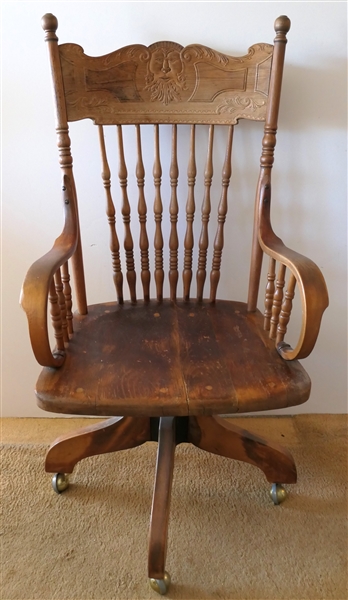 Oak Rolling Desk Chair with North Wind Face - Scrolled Arms - Chair Measures 43" Tall 22" Across