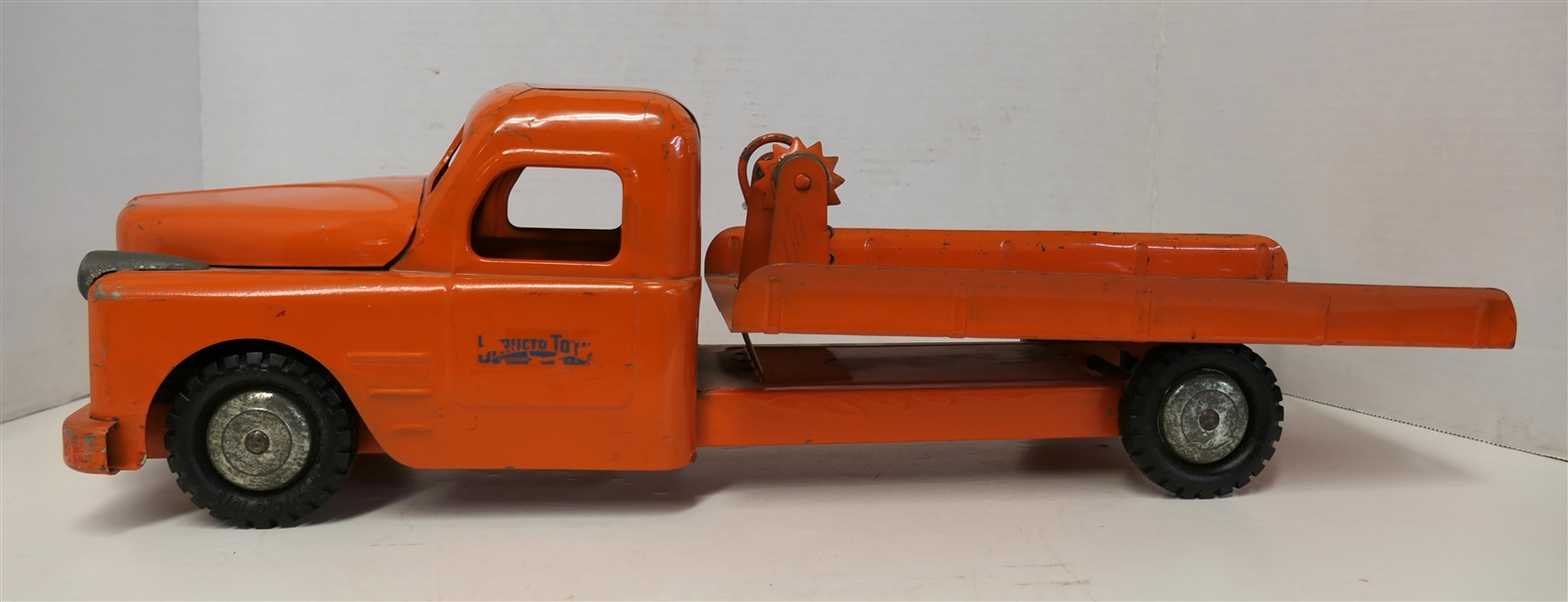 Structo Toys - Orange Pressed Steel Flat Bed Truck with Chain Wench - Truck Measures 6 1/2" Tall 21" Long