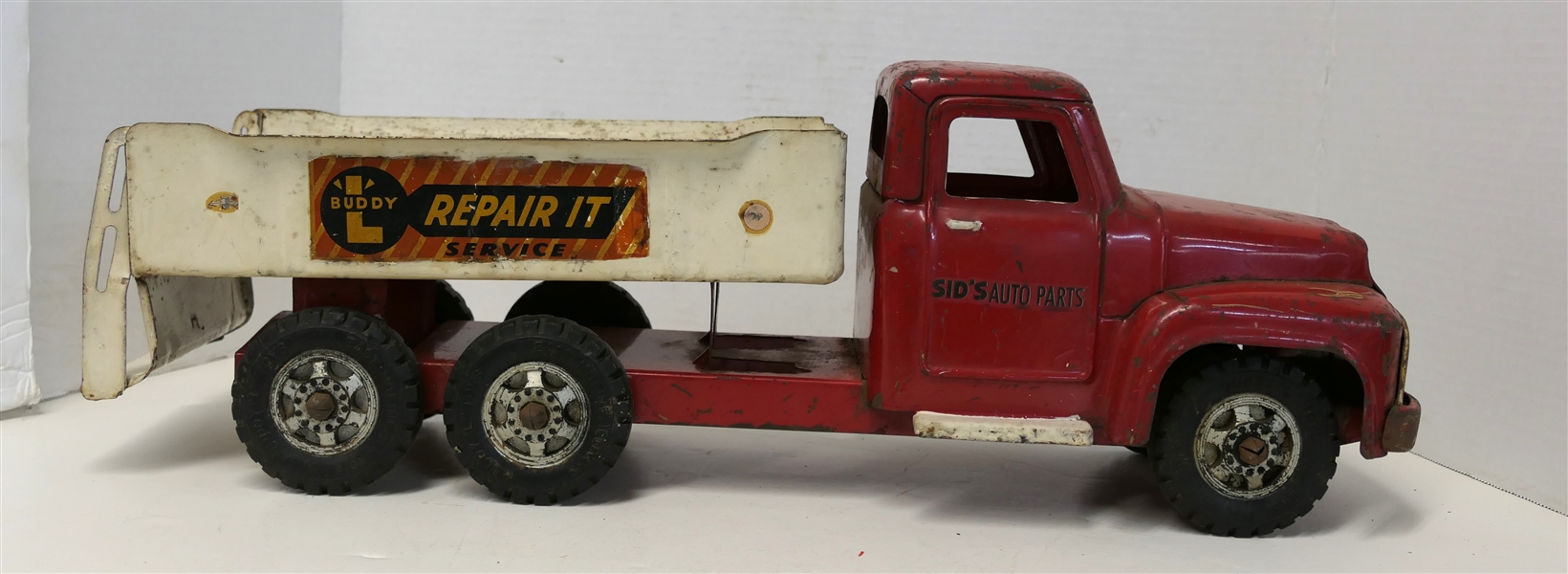 Buddy "L" Repair It Service "Sids Auto Parts" Pressed Steel Truck - Measures 7" Tall 20" Long - Played With Condition 