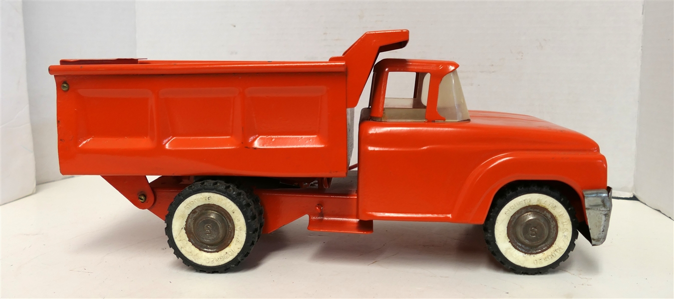 Structo Orange Pressed Steel Dump Truck - Measuring 5 1/2" Tall 14" Long