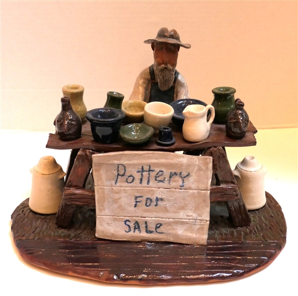 Jim Havner (Robbins, NC) Mud Critter Art Pottery Statue "Pottery For Sale" Pottery with Table and Pieces of Pottery - Measuring 7 1/2" Tall 10" by 7" 