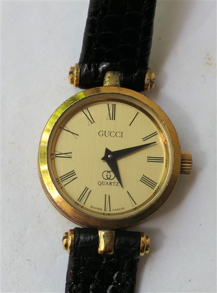 Gucci Quartz Wristwatch with Black Leather Band - Gold Dial with Red and Green Enamel Sides - Gucci Logo On Reverse