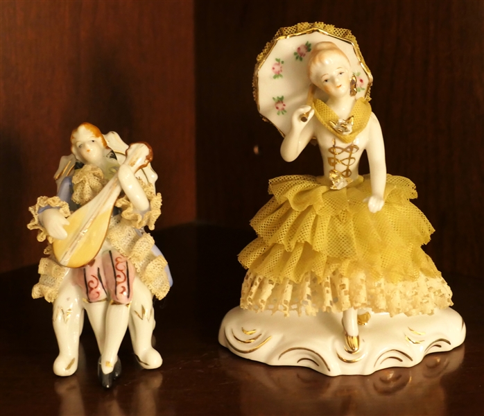 2 Porcelain Figures with Porcelain Lace - Lady with Parasol Measures 5" Tall Seated Musician Measures 3 1/2" Tall 