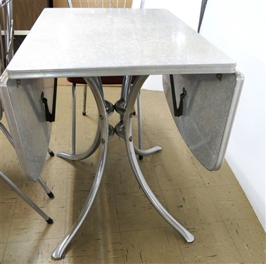 Outstanding 1950's Red Kitchen Table with 4 Red and Chrome Chairs - Table Has Drop Sides - 4 Red and Chrome  Chairs - Table Measures 28 1/2 Tall 30 by 21 Not Including Leaves - Leaf Measures 15