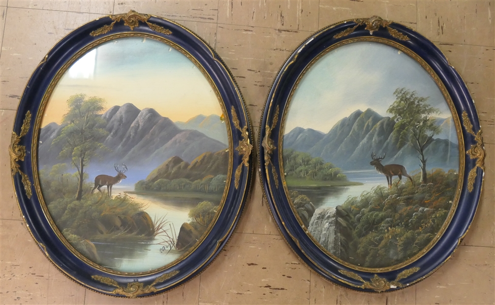 Pair of Edwardian Period Paintings of Scottish Highlands Scenes  - Landscapes with Stags - Signed by Artist - Framed in Navy Blue Oval Frames - Each Measures 24" by 20" 
