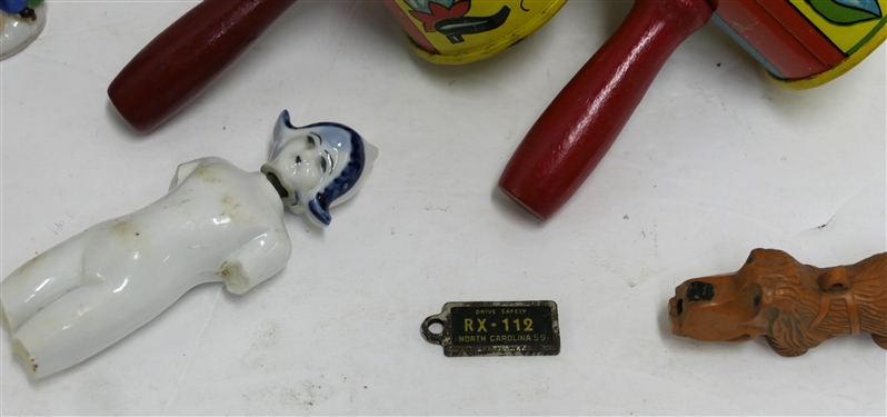 Vintage Lot Including Made in USA Tin Litho Noise Makers, Japan Porcelain Figures, China Doll - Needs To Be Re Strung, Pool Ball, Monkey Head, and Key License Tag