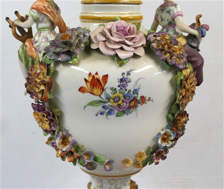 Large Meissen Style Porcelain Lidded Urn with Applied Cherubs, Porcelain Flowers, and Musicians - 3 Piece Construction - Lid, Urn, and Base. Flowers Are in Excellent Condition - Marked Schierholz -...