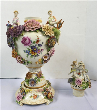 Large Meissen Style Porcelain Lidded Urn with Applied Cherubs, Porcelain Flowers, and Musicians - 3 Piece Construction - Lid, Urn, and Base. Flowers Are in Excellent Condition - Marked Schierholz -...