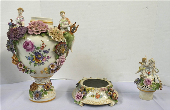 Large Meissen Style Porcelain Lidded Urn with Applied Cherubs, Porcelain Flowers, and Musicians - 3 Piece Construction - Lid, Urn, and Base. Flowers Are in Excellent Condition - Marked Schierholz -...