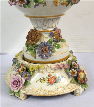 Large Meissen Style Porcelain Lidded Urn with Applied Cherubs, Porcelain Flowers, and Musicians - 3 Piece Construction - Lid, Urn, and Base. Flowers Are in Excellent Condition - Marked Schierholz -...