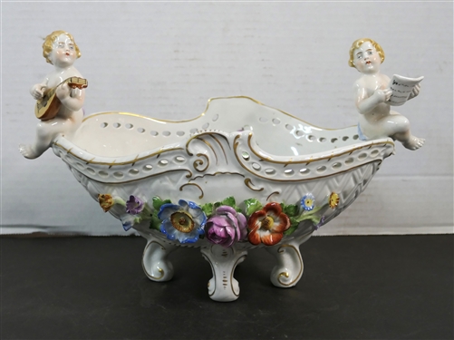 Meissen Style Porcelain Centerpiece Bowl with Applied Porcelain Flowers and Cherub Musicians - Signed Schierholz - Handmalaeri  - Flowers are in Excellent Condition Measures 7 1/2 tall 11 by 6 1/8