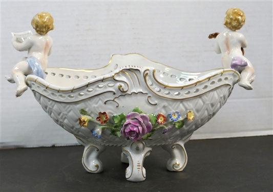 Meissen Style Porcelain Centerpiece Bowl with Applied Porcelain Flowers and Cherub Musicians - Signed Schierholz - Handmalaeri  - Flowers are in Excellent Condition Measures 7 1/2 tall 11 by 6 1/8