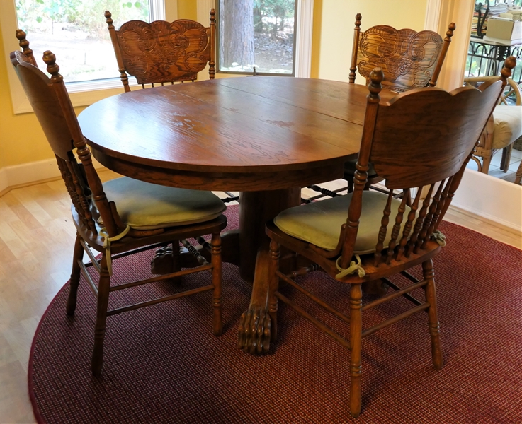 Antique Oak Claw Foot Table and 4 Press Carved Oak Side Chairs - Pedestal Base Table Has Carved Claw Feet - 1 Leaf - Table Measures 29 1/2" Tall 51" by 42" - Leaf Measures 9" Wide