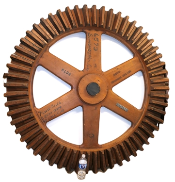 Simonds Mfg. Co. Large Wooden Gear / Cog Sign - Metal SIMONDS and 6579 on Center - Hand Painted 6579 Simonds Mfg. Co. - 7 Loose - Pieces 8 Extra Teeth, 4 1/4" Stock Core - Wheel Measures 55 1/2"...