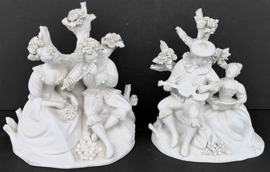 2 Italian White Porcelain Musician Courting Statues - Signed Italy and Stamped by Maker Inside - Flowers Appear to Be in Good Condition on Both - Flute Player Statue Measures 7 3/4" Tall 8" Across...