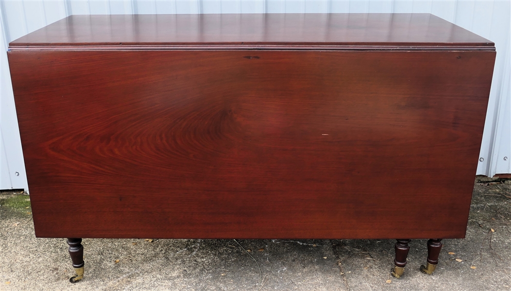 Fine Empire Cherry Drop Leaf Table - Reeded Column Legs with Substantial Brass Tipped Feet - Unusual Scrolled Ends - Pegged Construction - Table Measures 27 1/2" Tall 14 1/2" by 19 1/2" Each Leaf...