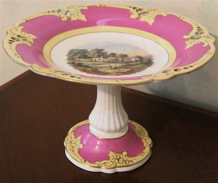 Beautiful Pink and Yellow Decorated Compote with Beautiful Pastoral Scene in Center  - Measures 7 1/2" Tall 11 1/2" Across - Hairline Crack on Edge  - Not Visible From Underside