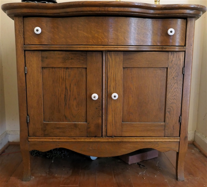 Oak Serpentine Front Washstand - Single Drawer Over Double Paneled Doors - Measures 28 1/2" tall 32" by 20" 